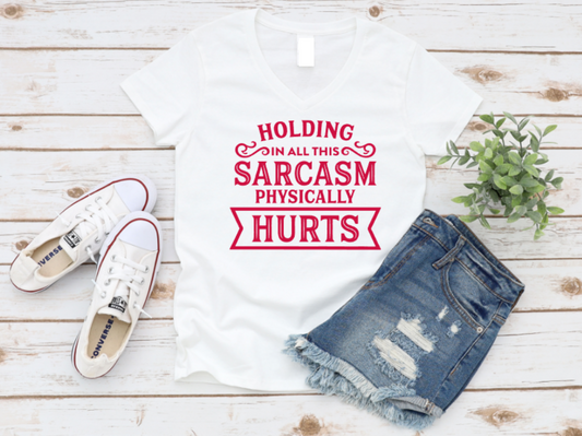 White t-shirt with red text, denim shorts, and white sneakers on a wooden surface. www.missmafia.com
