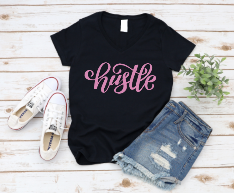 Black unisex t-shirt featuring the word “Hustle” in a bold, motivational font – perfect for entrepreneurs, gym-goers, and hard workers.