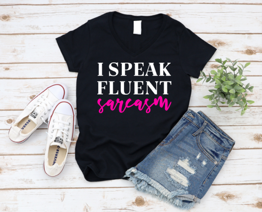 Black unisex t-shirt with bold black text that says “I Speak Fluent Sarcasm,” perfect for witty, sarcastic personalities who keep it real.