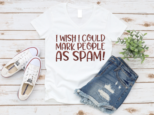 White t-shirt with 'I wish I could mark people as spam!' text, paired with white sneakers and denim shorts on a wooden surface. www.missmafia.com