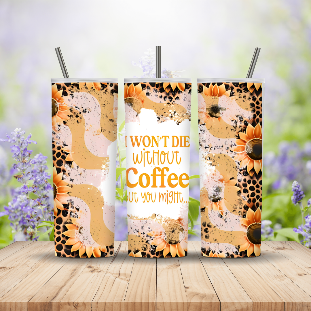 Three sunflower-themed tumblers with straws on a wooden surface with a blurred natural background.