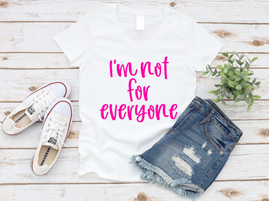 White t-shirt with 'I'm not for everyone' text, denim shorts, and white sneakers on a wooden surface. www.missmafia.com