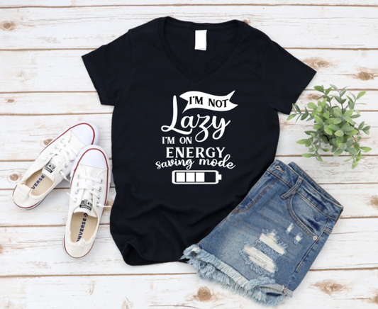 Black t-shirt with humorous text design on a wooden surface with shoes and shorts. www.missmafia.com