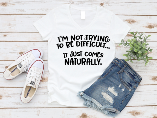 White t-shirt with text, white sneakers, and denim shorts on a wooden surface. www.missmafia.com
