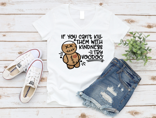 White tank top with voodoo doll graphic and text, paired with denim shorts and white sneakers on a wooden surface. shop now www.missmafia.com