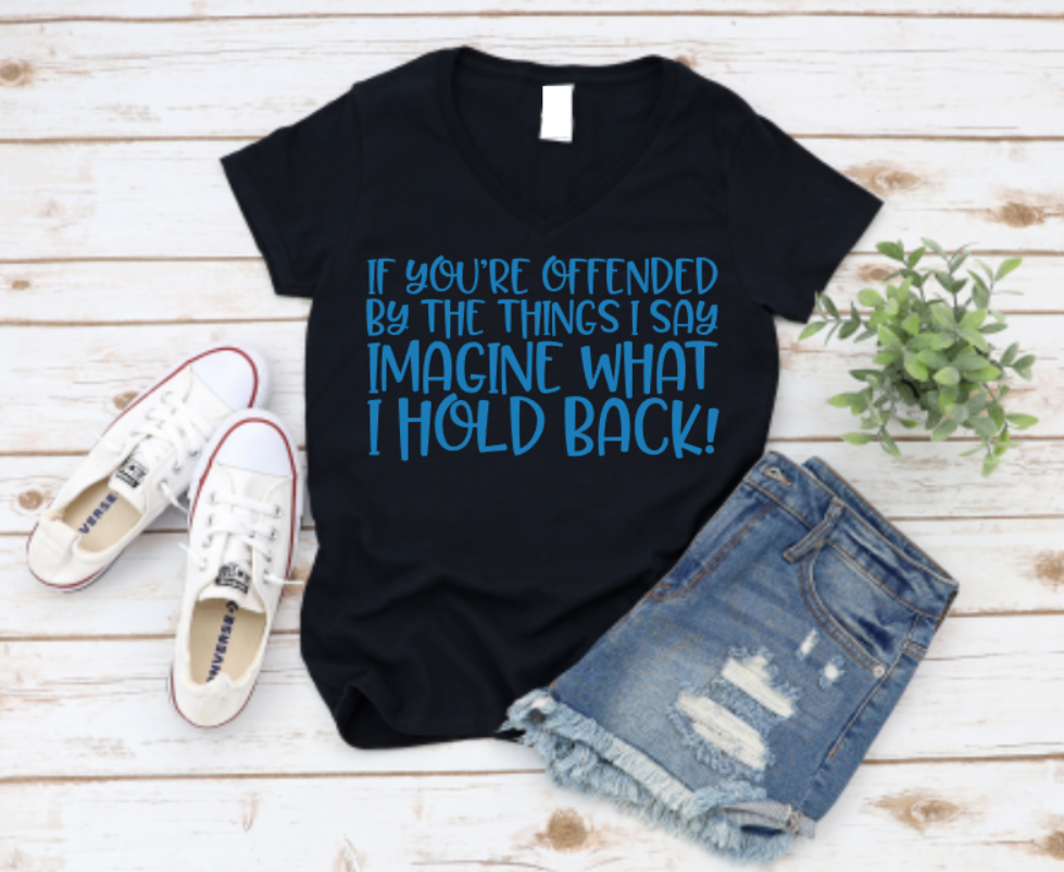 Black t-shirt with blue text, white sneakers, and denim shorts on a wooden surface. Shop Now www.missmafia.com