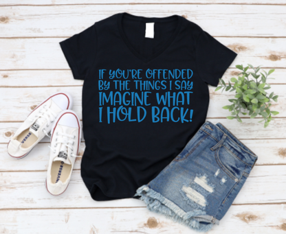 Black t-shirt with blue text, white sneakers, and denim shorts on a wooden surface. Shop Now www.missmafia.com
