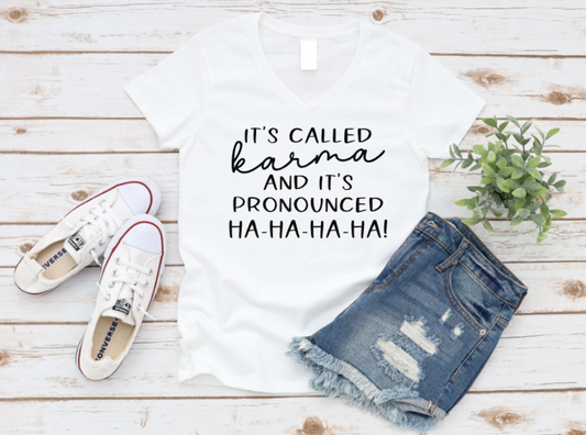 White t-shirt with humorous text, blue jeans, and white sneakers on a wooden surface. www.missmafia.com