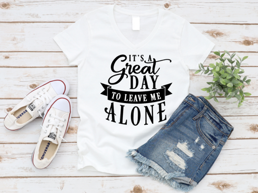White t-shirt with humorous text, denim shorts, and white sneakers on a wooden surface. www.missmafia.com