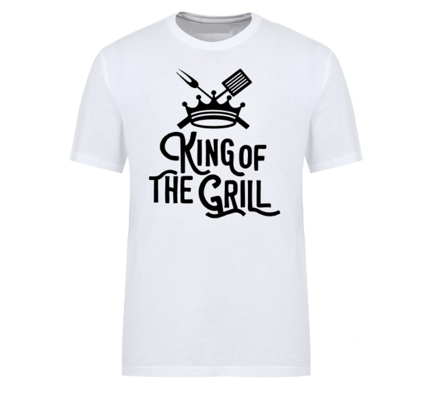 White t-shirt with "King of the Grill" text design, featuring a crown, spatula, and meat fork – perfect for BBQ dads and grill masters.