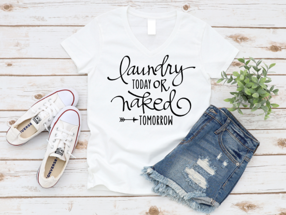 White t-shirt with 'Laundry today or naked tomorrow' text, white sneakers, and denim shorts on a wooden surface. www.missmafia.com