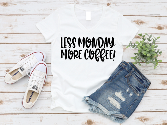 White t-shirt with 'LESS MONDAY MORE COFFEE!' text, denim shorts, white sneakers, and a plant on a wooden surface. www.missmafia.com