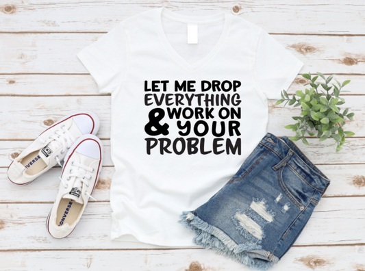 White t-shirt with text, denim shorts, and sneakers on a wooden surface. www.missmafia.com