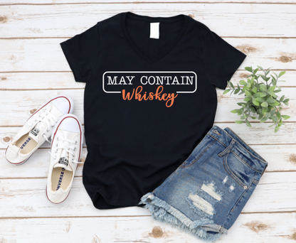 Black unisex t-shirt with bold text that says “May Contain Whiskey” in black and orange – perfect for whiskey lovers, parties, and weekend vibes.