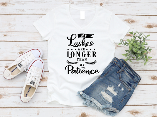White t-shirt with text, denim shorts, and white sneakers on a wooden surface.  www.missmafia.com