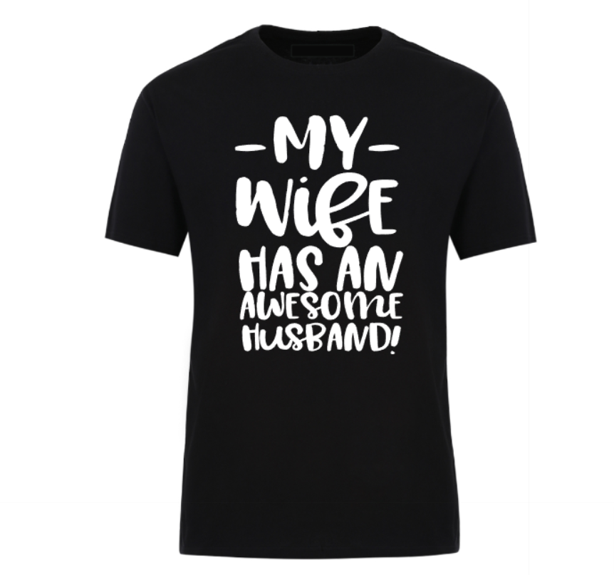 Black t-shirt with bold black text that reads “My Wife Has an Awesome Husband,” displayed flat with casual jeans and white sneakers – a humorous gift idea for confident husbands.