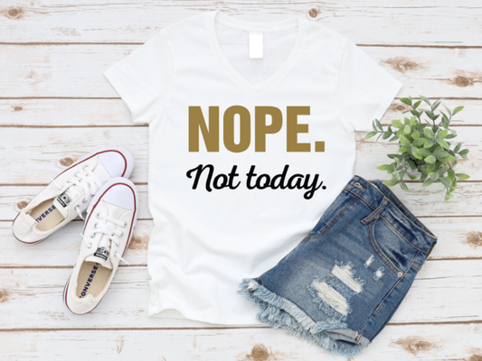 White t-shirt with 'NOPE. Not today.' text, white sneakers, and denim shorts on a wooden surface. www.missmafia.com