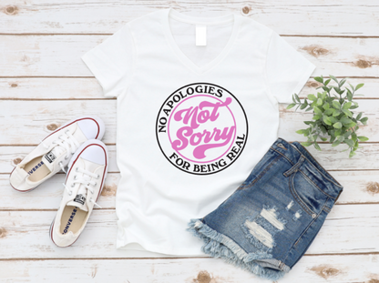 White t-shirt with pink and black text, white sneakers, and denim shorts on a wooden surface. www.missmafia.com