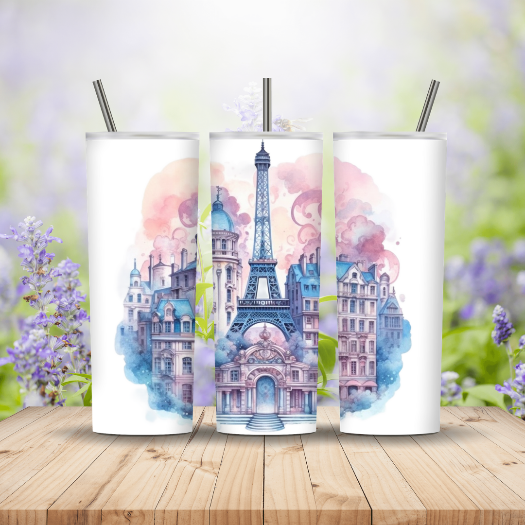 Three tumblers with Eiffel Tower design on a wooden surface with flowers in the background