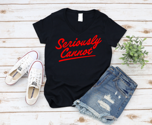 Black t-shirt with 'Seriously Cannot' text, white sneakers, and denim shorts on a wooden surface. www.missmafia.com