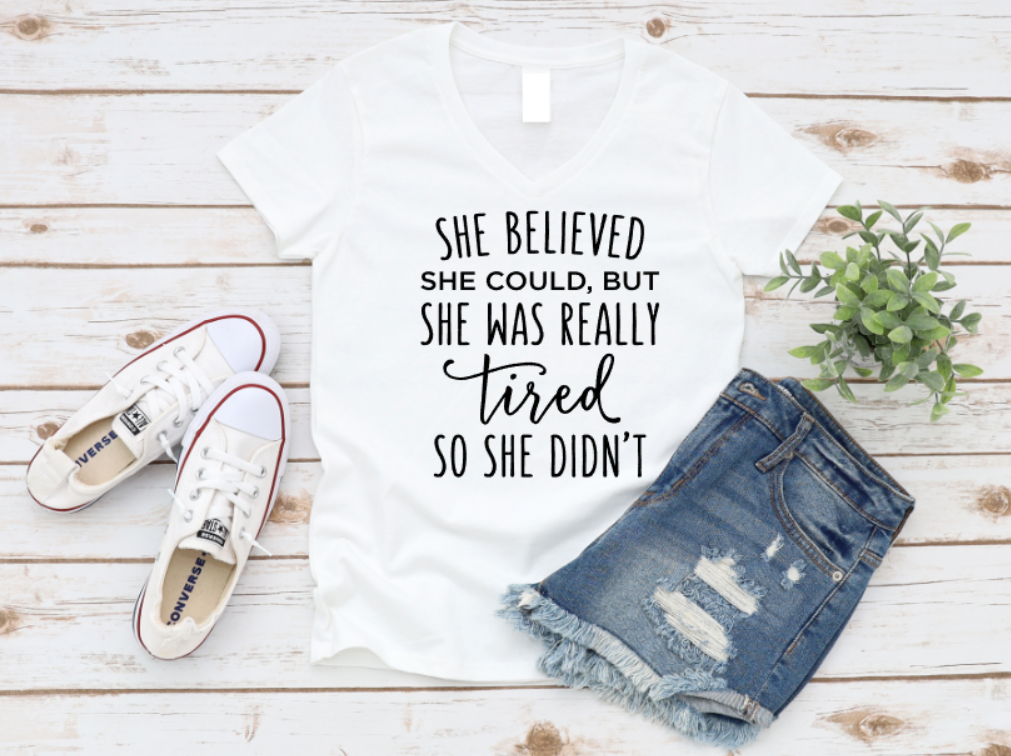 T-shirt with motivational quote, sneakers, and denim shorts on a wooden surface. www.missmafia.com