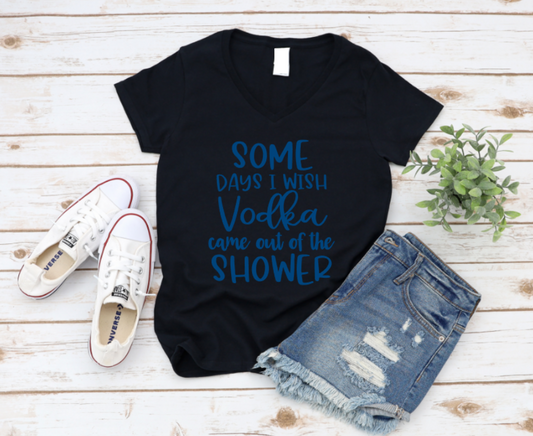 Black t-shirt with blue text, white sneakers, denim shorts, and a plant on a wooden surface. www.missmafia.com