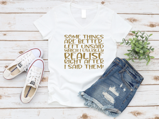 White t-shirt with printed text, denim shorts, white sneakers, and a plant on a wooden surface. www.missmafia.com