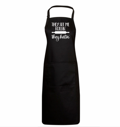 Black apron with white text on a white background