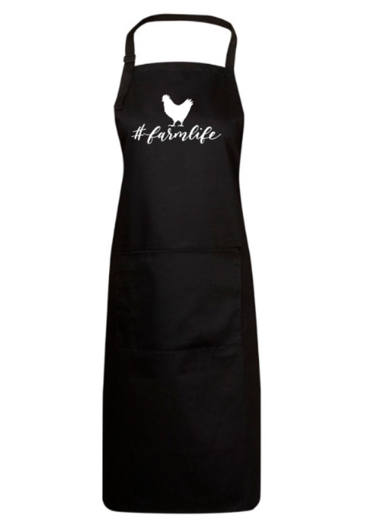 Black apron with '#farmlife' and a chicken graphic on a white background