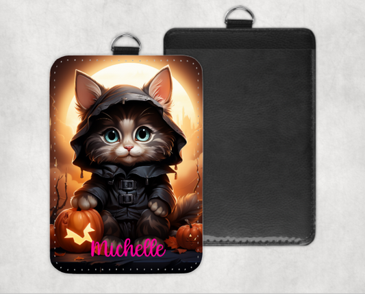 Cute Halloween black cat in hooded cloak holding a pumpkin, personalized ID badge holder with custom name in pink text.  Miss Mafia