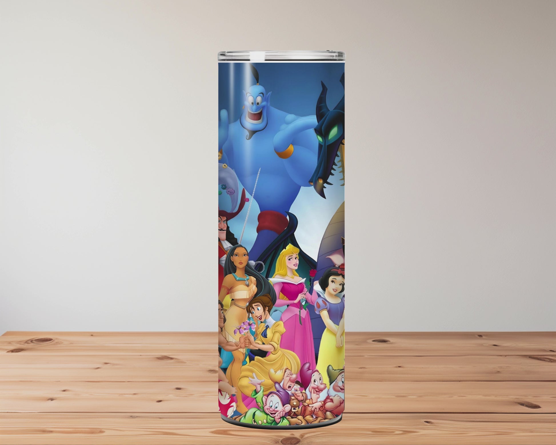20oz stainless steel tumbler featuring a vibrant collage of animated fairytale characters including princesses, magical creatures, and classic animals on a deep blue background, surrounded by colourful details and whimsical energy. Miss Mafia