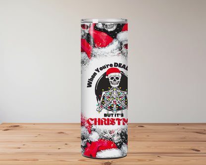 Tumbler with skull and Santa Claus design on a wooden surface background Miss Mafia