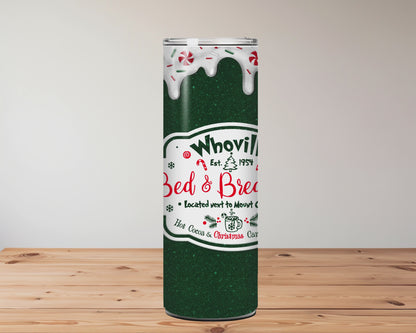 green tumbler with 'Whoville Bed & Breakfast' logo on a wooden surface