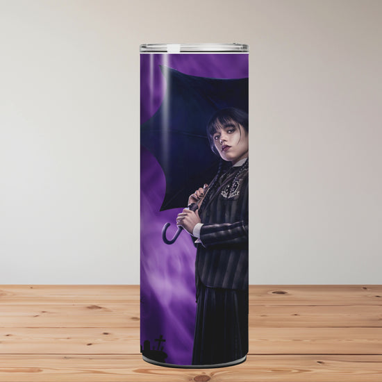 Tumbler with Halloween-themed designs on a wooden surface Miss Mafia