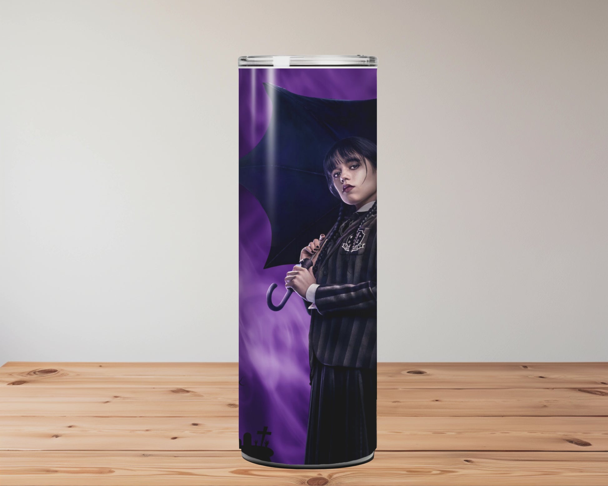 Tumbler with Halloween-themed designs on a wooden surface Miss Mafia