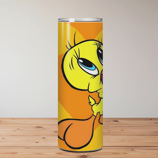 Tumbler with a cartoon character on an orange background, placed on a wooden surface Miss Mafia
