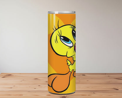Tumbler with a cartoon character on an orange background, placed on a wooden surface Miss Mafia