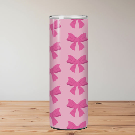 Tumblers with bow pattern on a wooden surface Miss Mafia