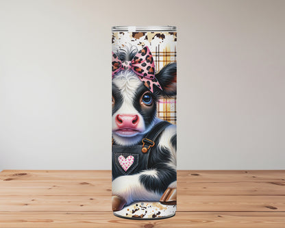 Tumbler design featuring a cow with a bow, sunflowers, and text 'Just a Girl Who Loves Cows' on a wooden surface Miss Mafia