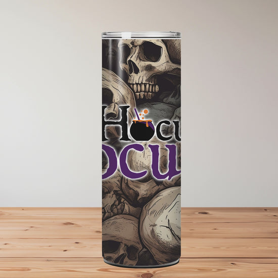 Skull-themed product with 'Hocus Pocus' text on a wooden surface background Miss Mafia