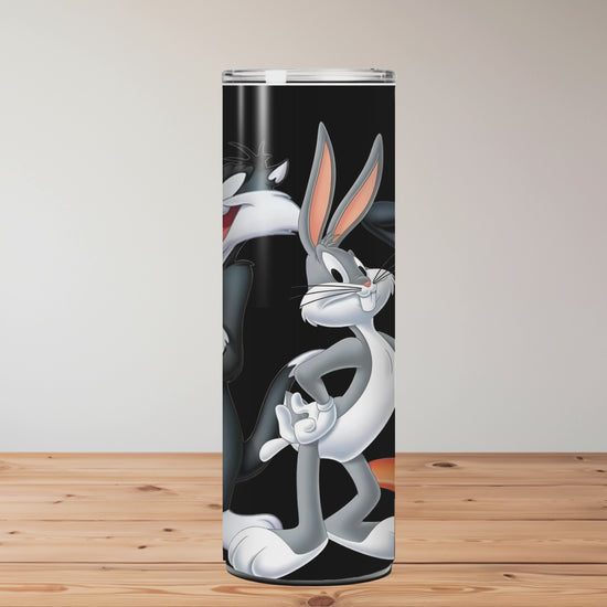 Cartoon character tumbler with straw on a wooden surface Miss Mafia