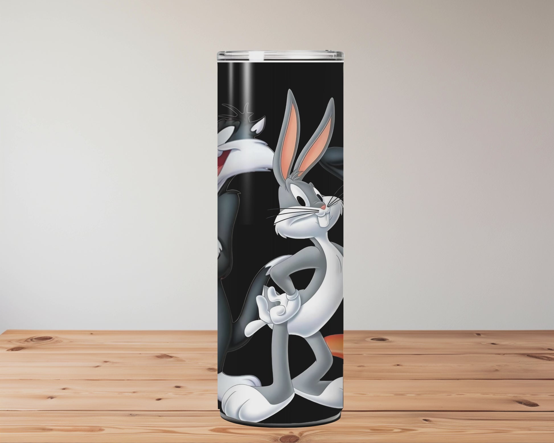 Cartoon character tumbler with straw on a wooden surface Miss Mafia