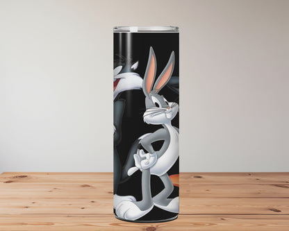 Cartoon character tumbler with straw on a wooden surface Miss Mafia