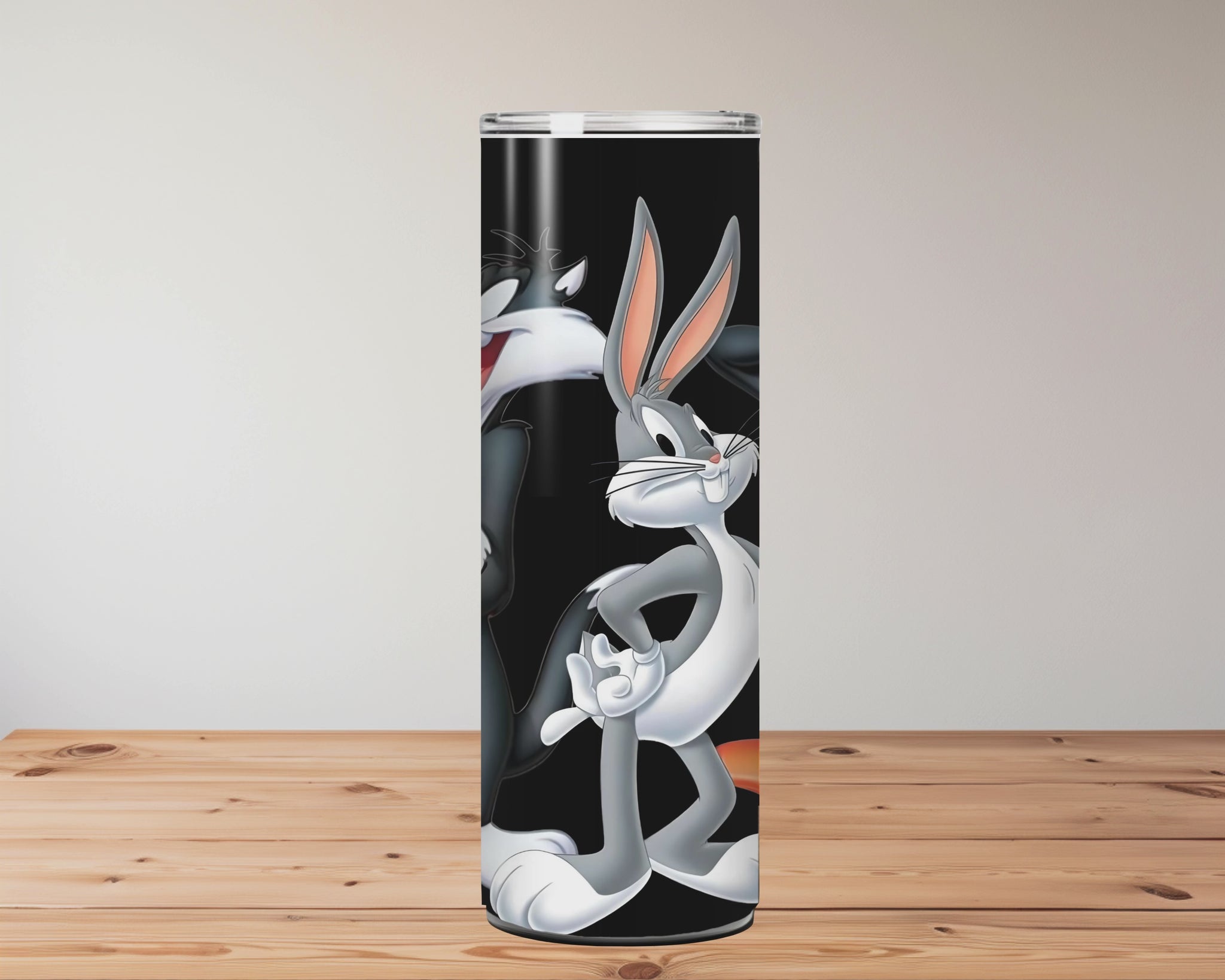 Cartoon character tumbler with straw on a wooden surface Miss Mafia