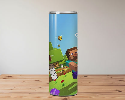 Three colourful tumblers with Minecraft-themed designs on a wooden surface. Miss Mafia