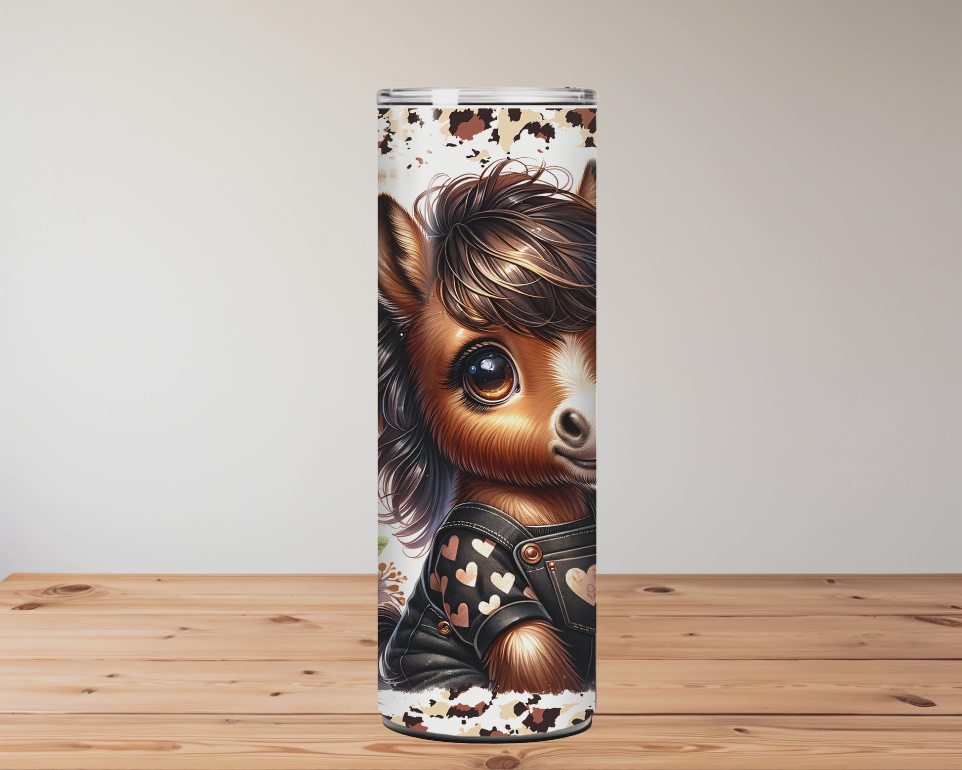 Tumbler with a horse design and floral elements on a wooden surface. Miss Mafia