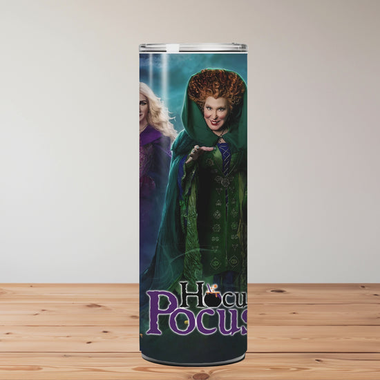 tumbler with 'Hocus Pocus' characters on a wooden surface Miss Mafia