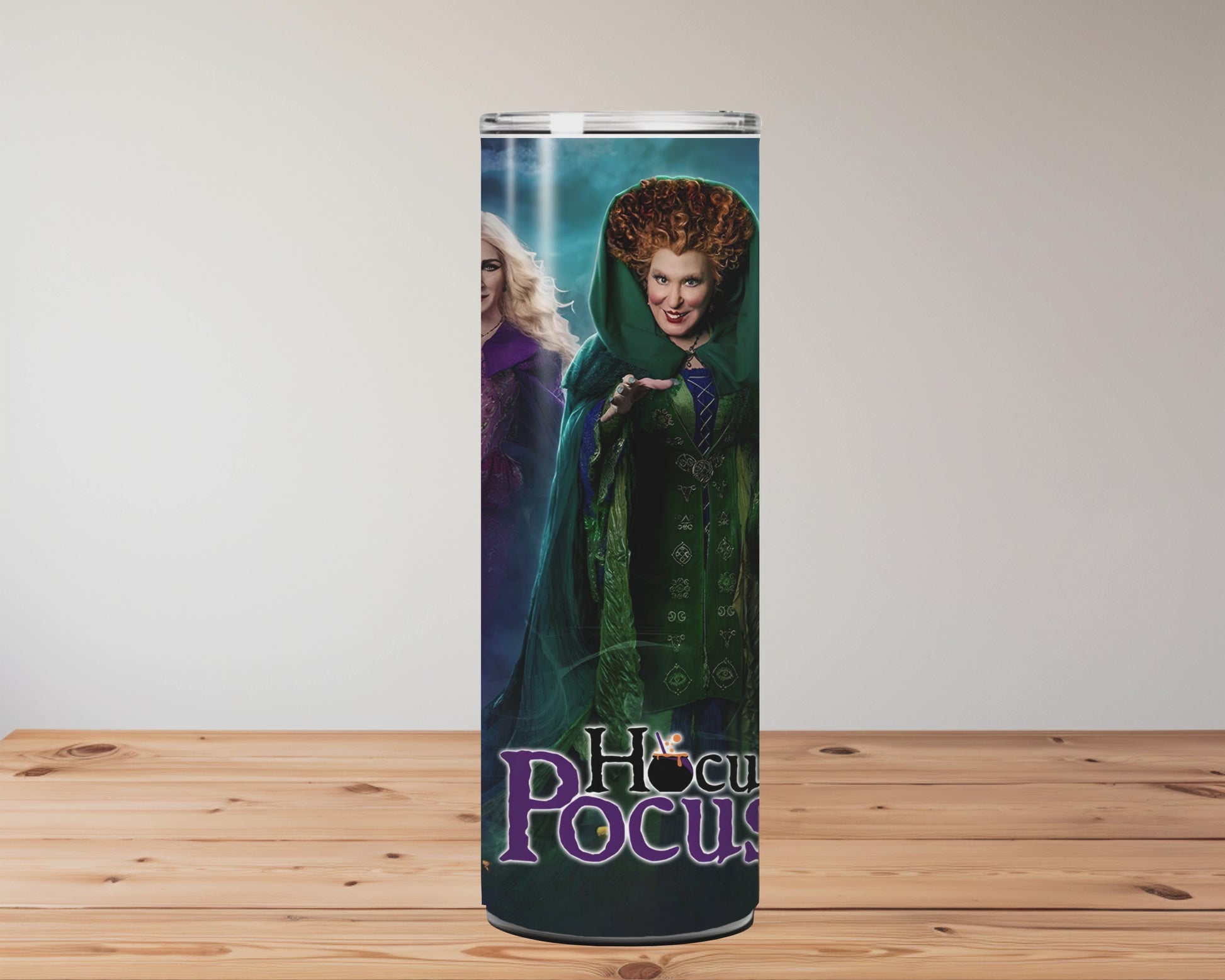 tumbler with 'Hocus Pocus' characters on a wooden surface Miss Mafia