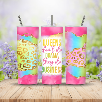 Three colorful tumblers with motivational quote and leopard print design on a wooden surface with a floral background.